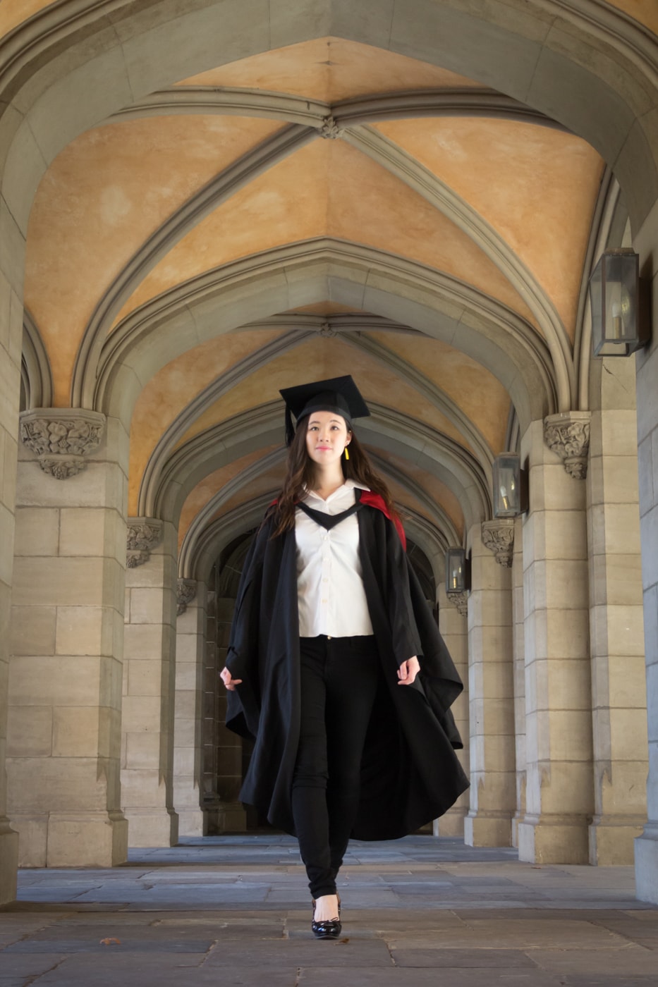 UniMelb graduate wearing gown set